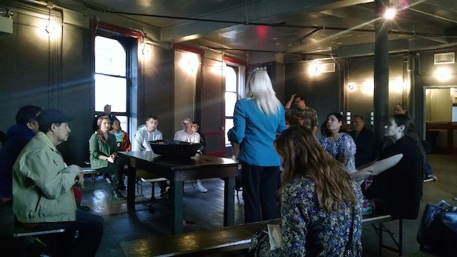 Community members meet with Bushwick Assemblywoman Maritza Davila at Market Hotel.