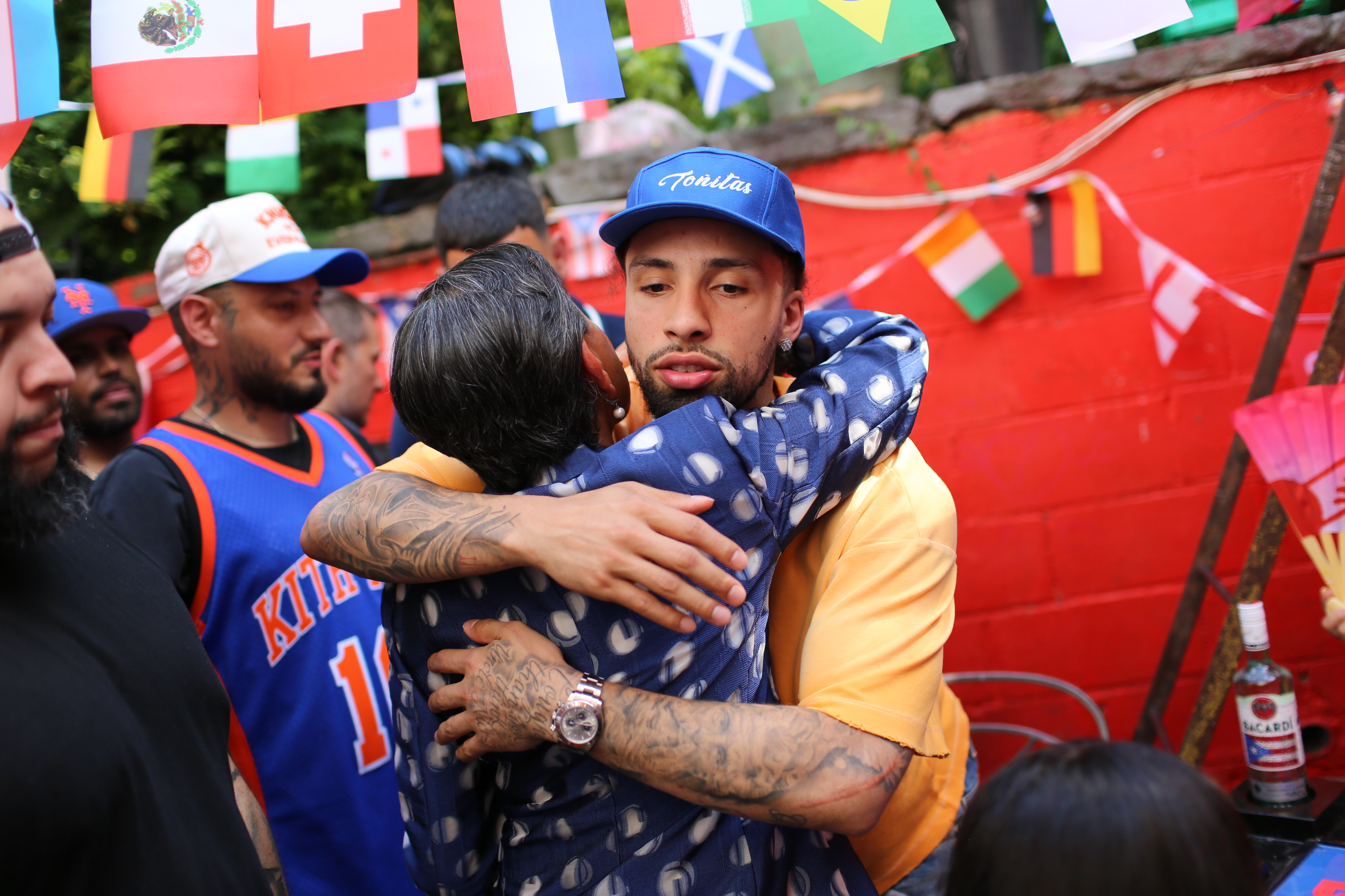 Jose Alvarado, Antonio Reynoso and Nydia Velazquez celebrate the Knicks championship at Toñita's Caribbean Social Club
