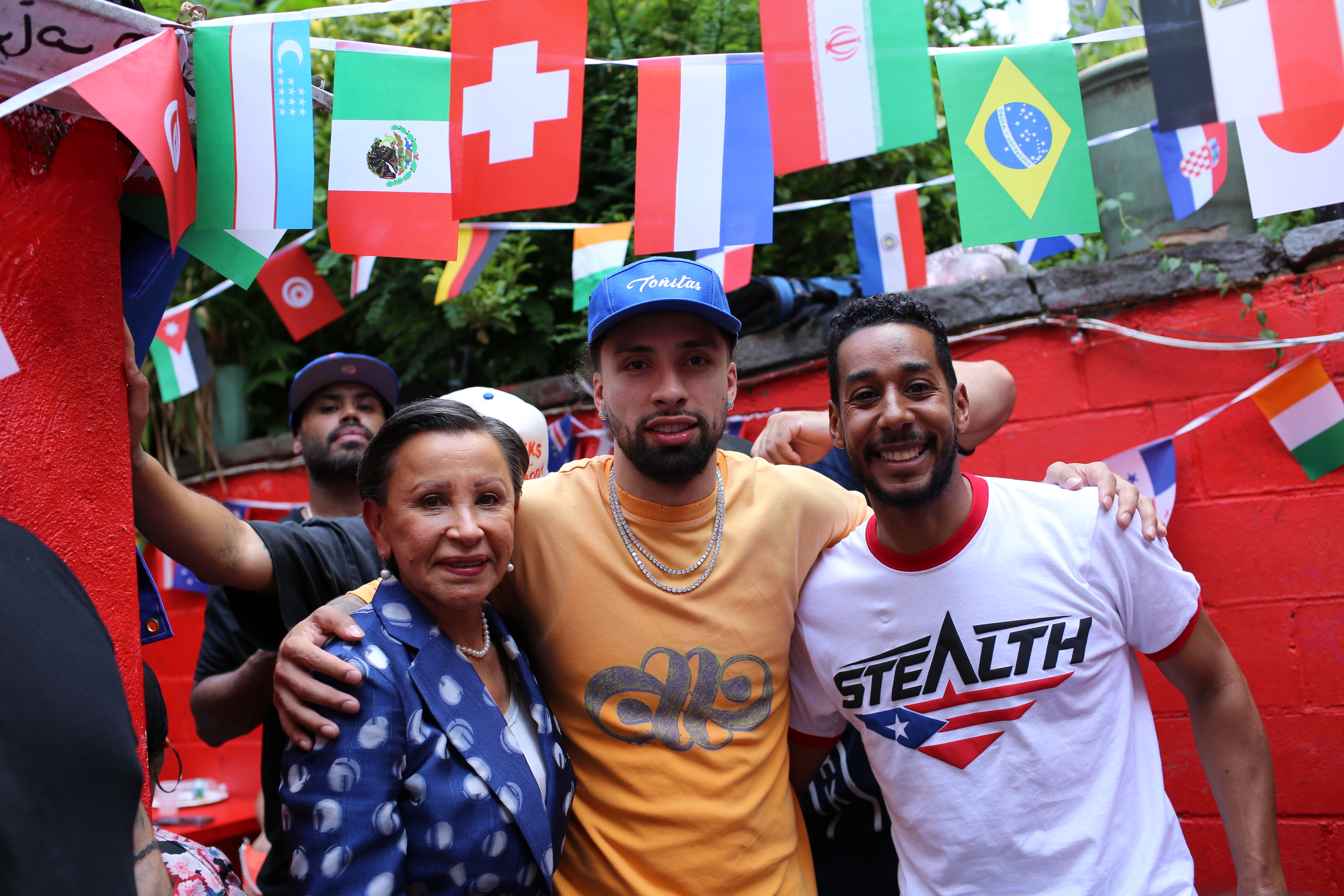 Jose Alvarado, Antonio Reynoso and Nydia Velazquez celebrate the Knicks championship at Toñita's Caribbean Social Club