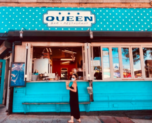 The bright blue front of Queen, a Mediterranean bar and restaurant on Starr Street.