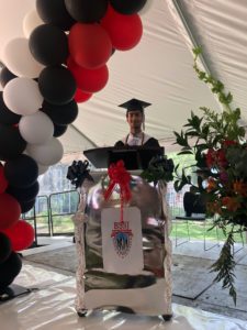 Sayed Anwar at the podium at his high school graduation. 