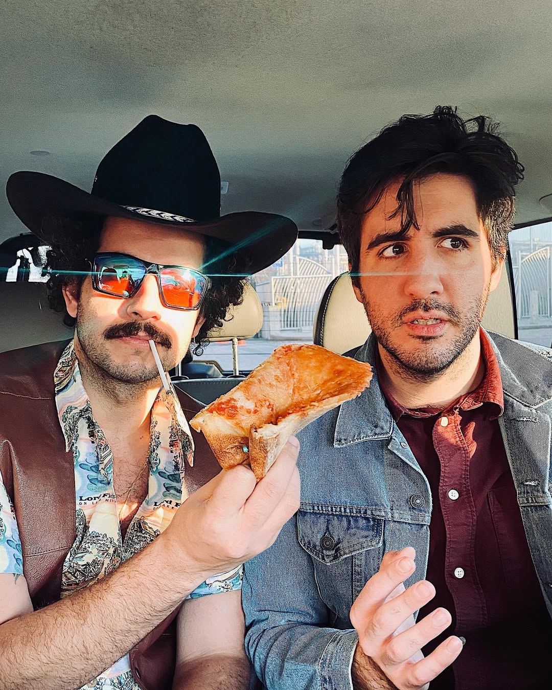 DiMieri and collaborator in car with pizza