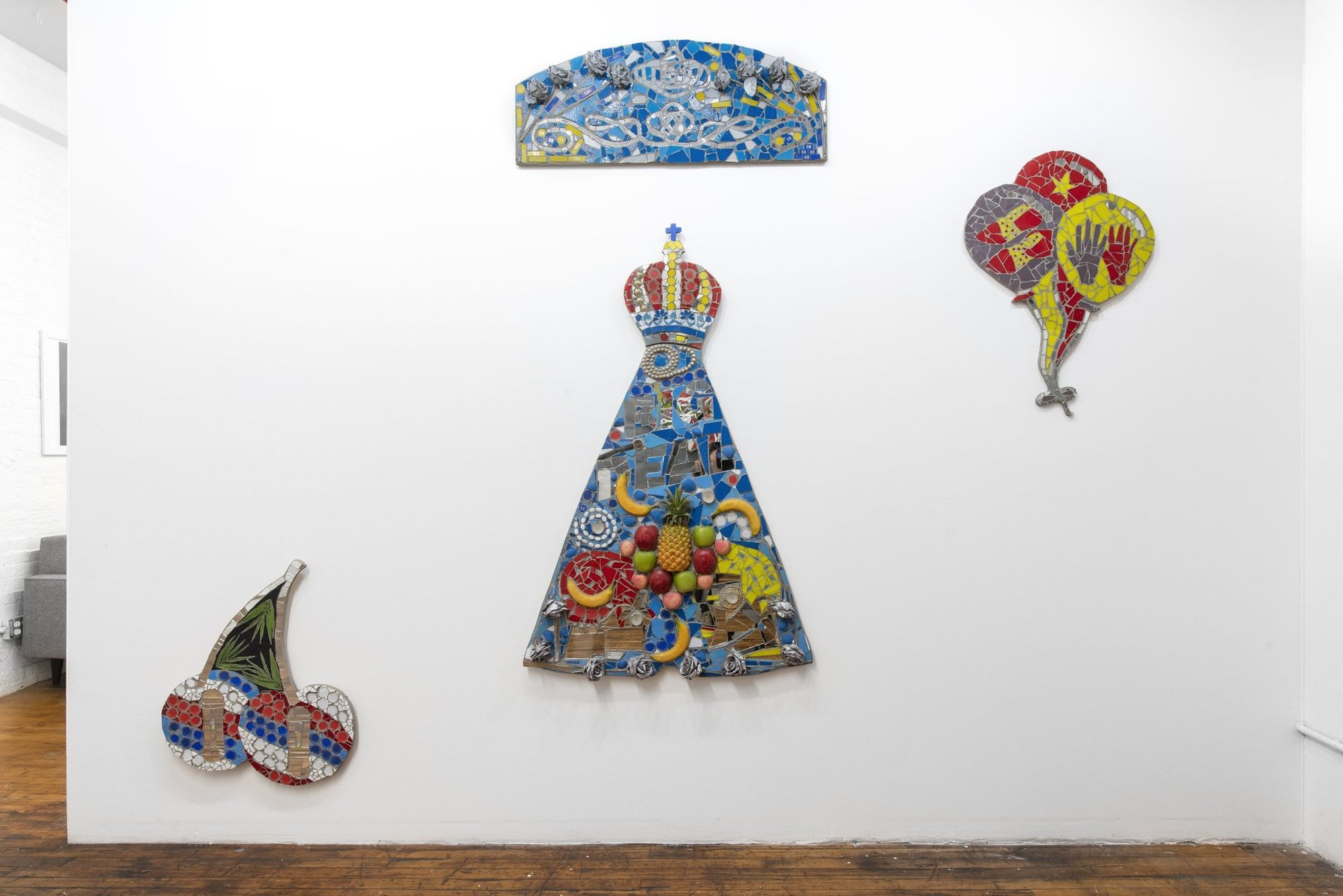 Plastic flowers, eagle feathers, and birthday candles: Marco DaSilva’s mosaic assemblages open at a Gowanus gallery Saturday