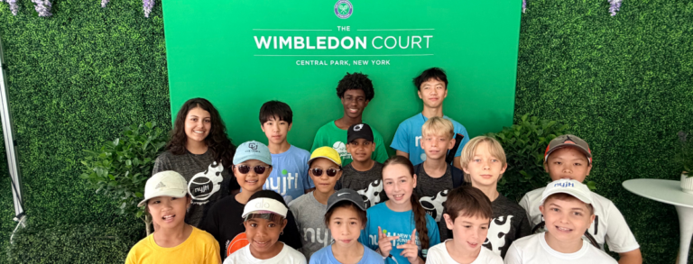 Wimbledon built a real grass court at Wollman Rink. Twenty-four NYJTL kids got to hit on it.