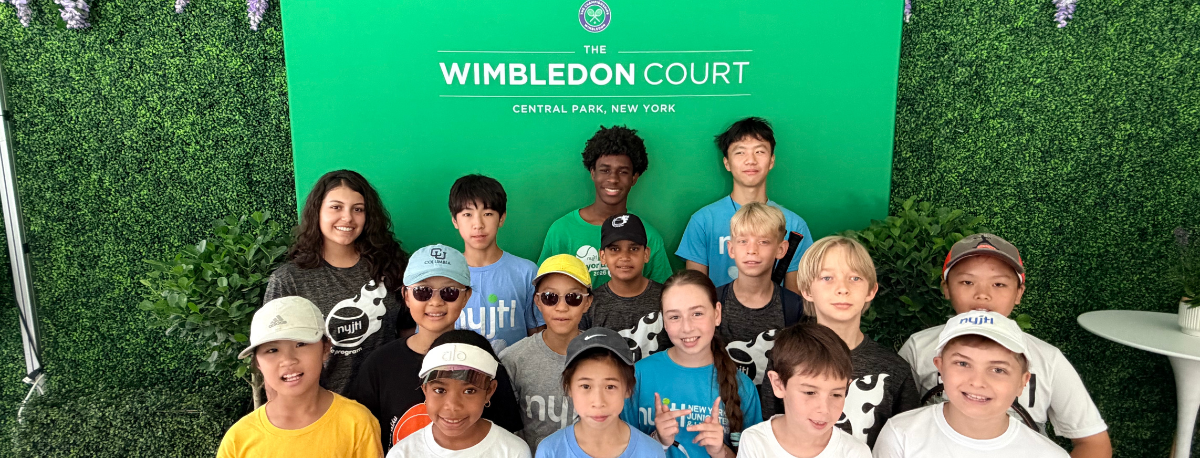 Wimbledon built a real grass court at Wollman Rink. Twenty-four NYJTL kids got to hit on it.