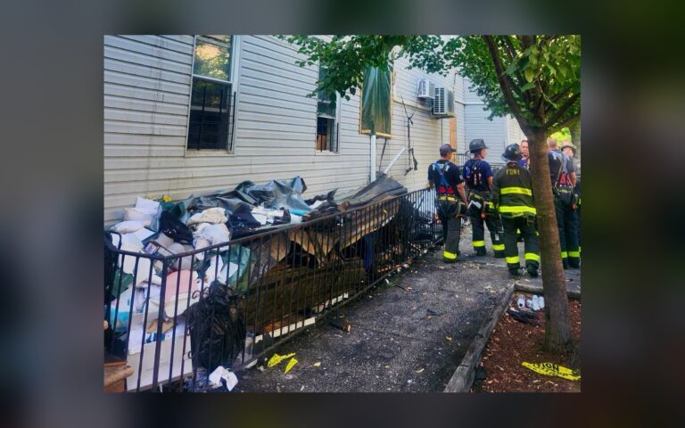 A Ridgewood fire jumped from one building to the next. Eight households are now starting over with Red Cross checks