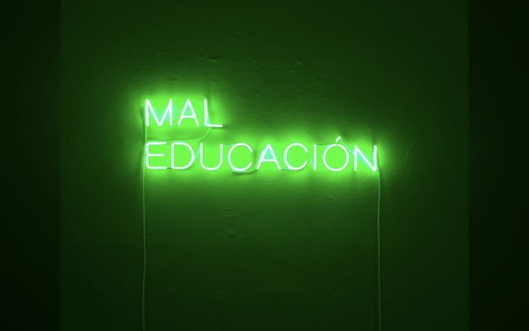 A Bushwick gallery misspelled ‘Old School’ in neon on purpose, and the typo is a full argument about capitalism