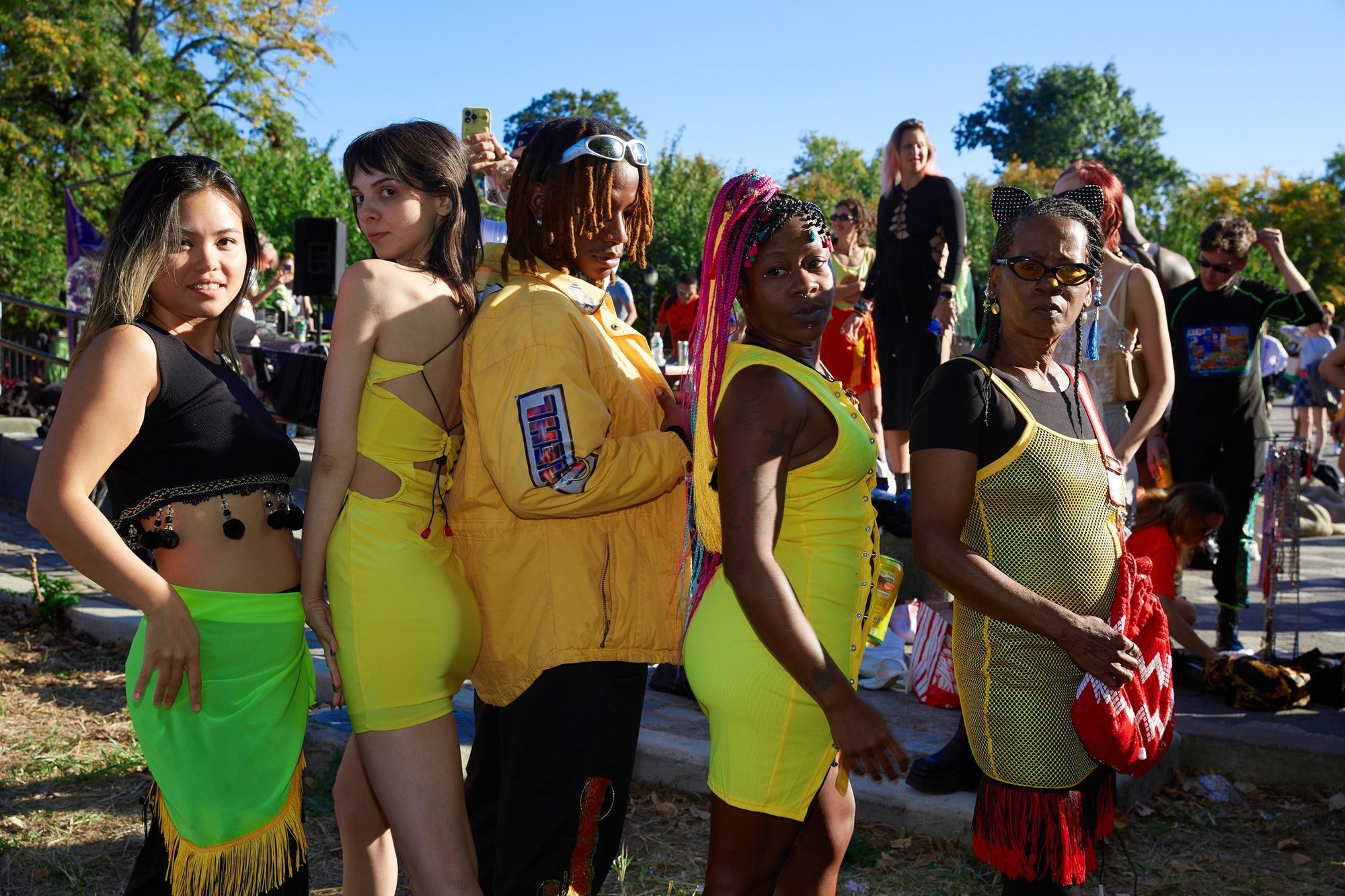 Five models of different ages in yellow outfits at AMEHL's Golosinas show in Maria Hernandez Park.