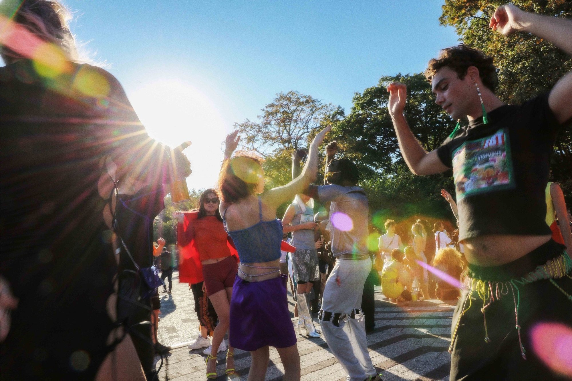 Models and the crowd dance on the plaza at AMEHL's Golosinas show in Maria Hernandez Park.
